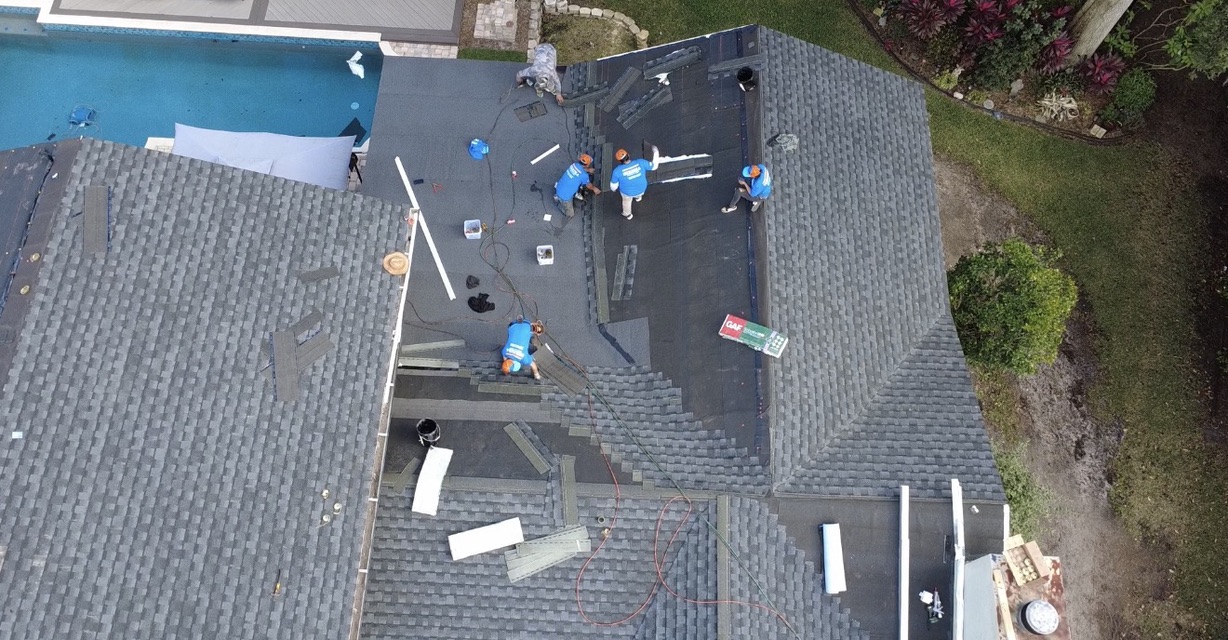 Aerial view of the Herrera crew installing a new shingle roof in Lake Nona